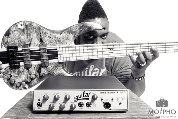 Aguilar advertisement featuring Pennal Johnson with his Wyn bass
